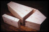 "Coffin with Section Removed to Store Thoughts on Death" l981-3, pine, 77" x32" x 16" (box: 29-3/4"x6"x6")